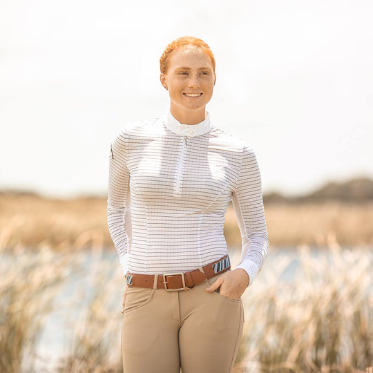 Equestrian model facing the camera wearing Emcee Apparel's Cantika in white