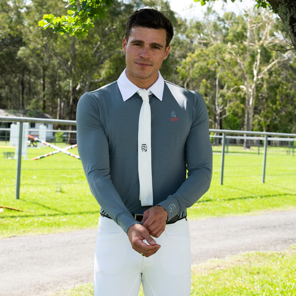 An equestrian model wearing the Balck Marco shirt by Emcee Apparel